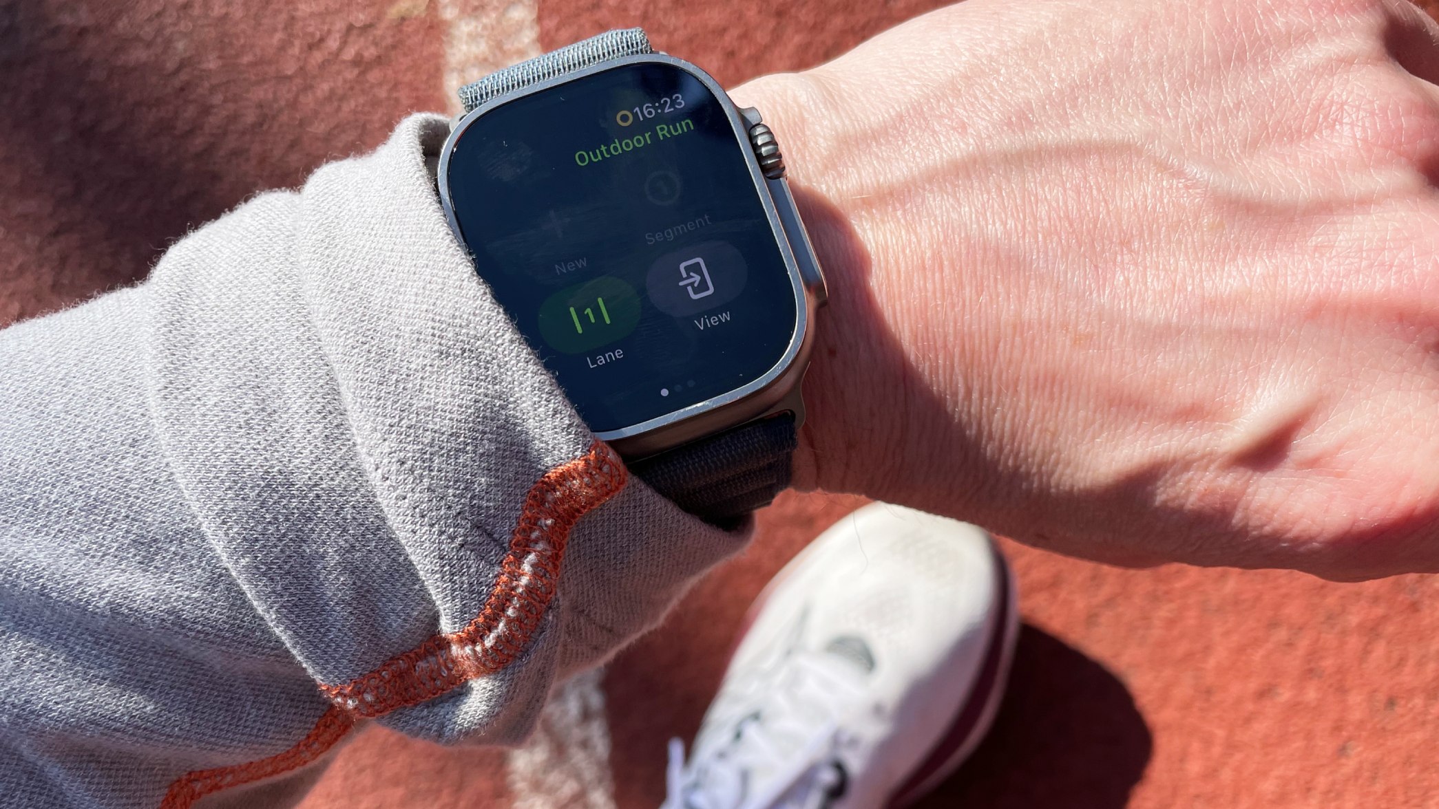 Apple Watch Ultra worn on a track