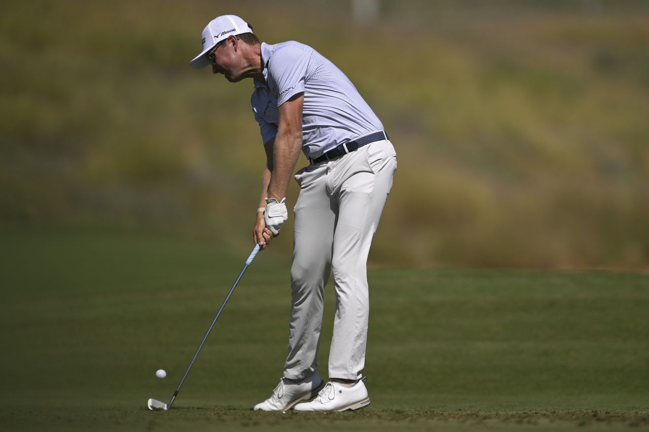 Ben Griffin hits an iron shot from the fairway