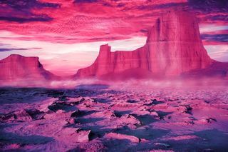 Desert landscape in ultraviolet and pink tones.