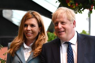 Boris Johnson and his girlfriend Carrie Symonds arrive at the Conservative Party Conference
