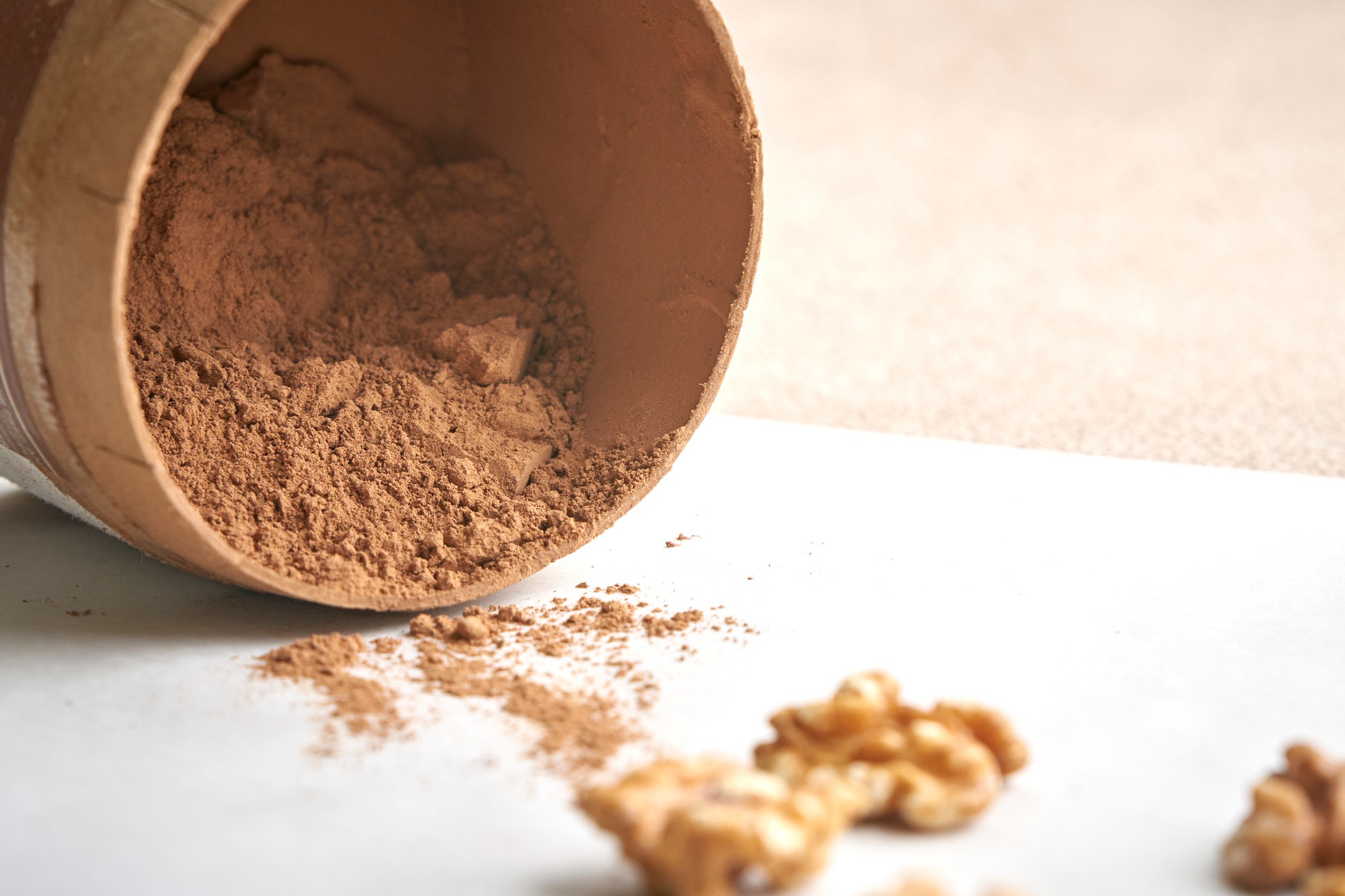 Protein powder spilling out of container