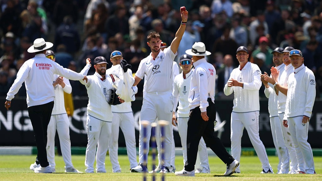 Josh Tongue holds up the ball to celebrate taking five wickets on the opening day of the Boxing Day of the Ashes 2025/26.