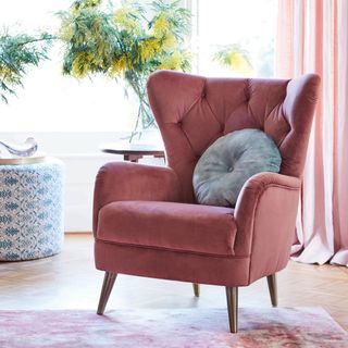 living room with pink chair