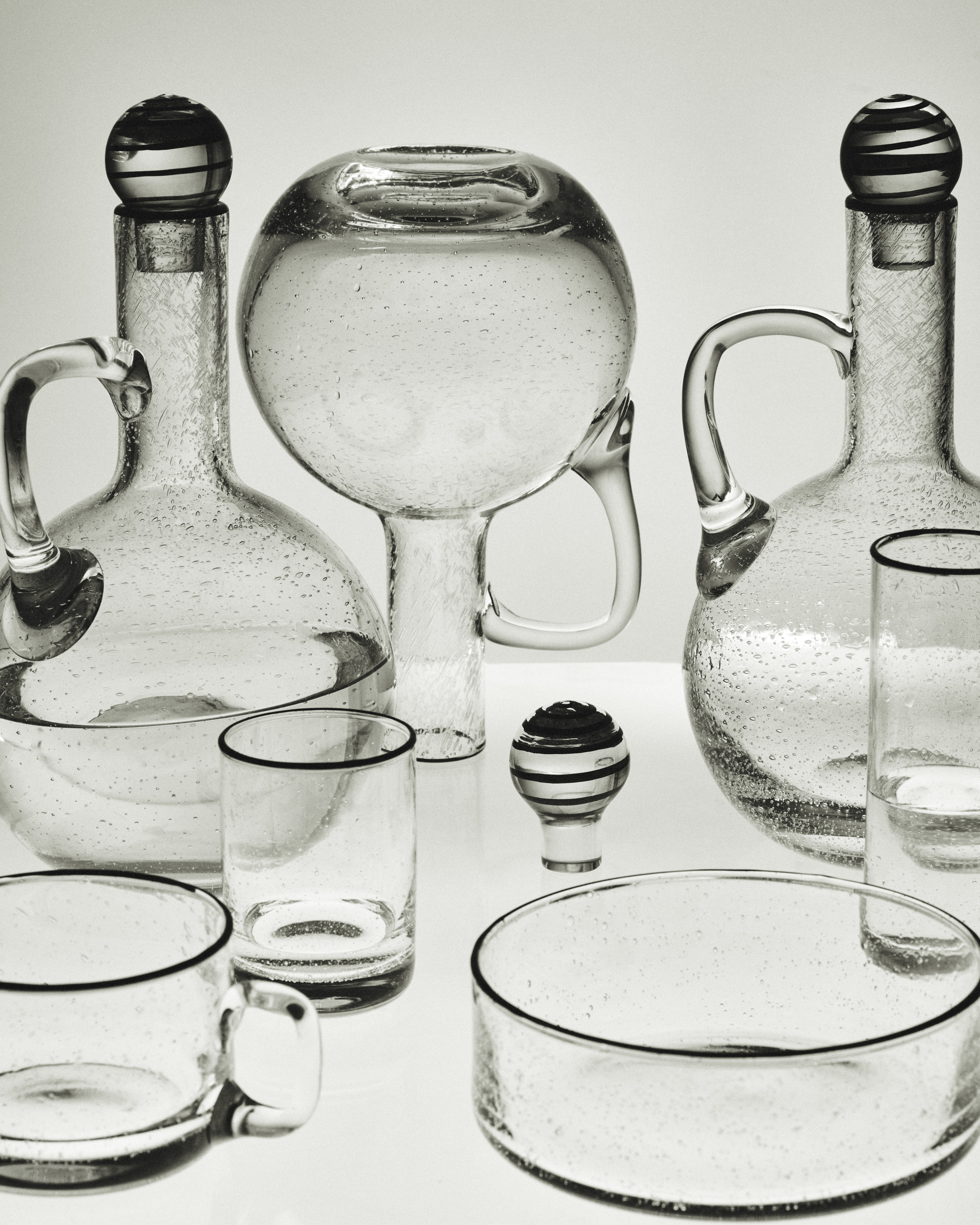 an image of glassware, plates, and carafes from the S.R. Collection