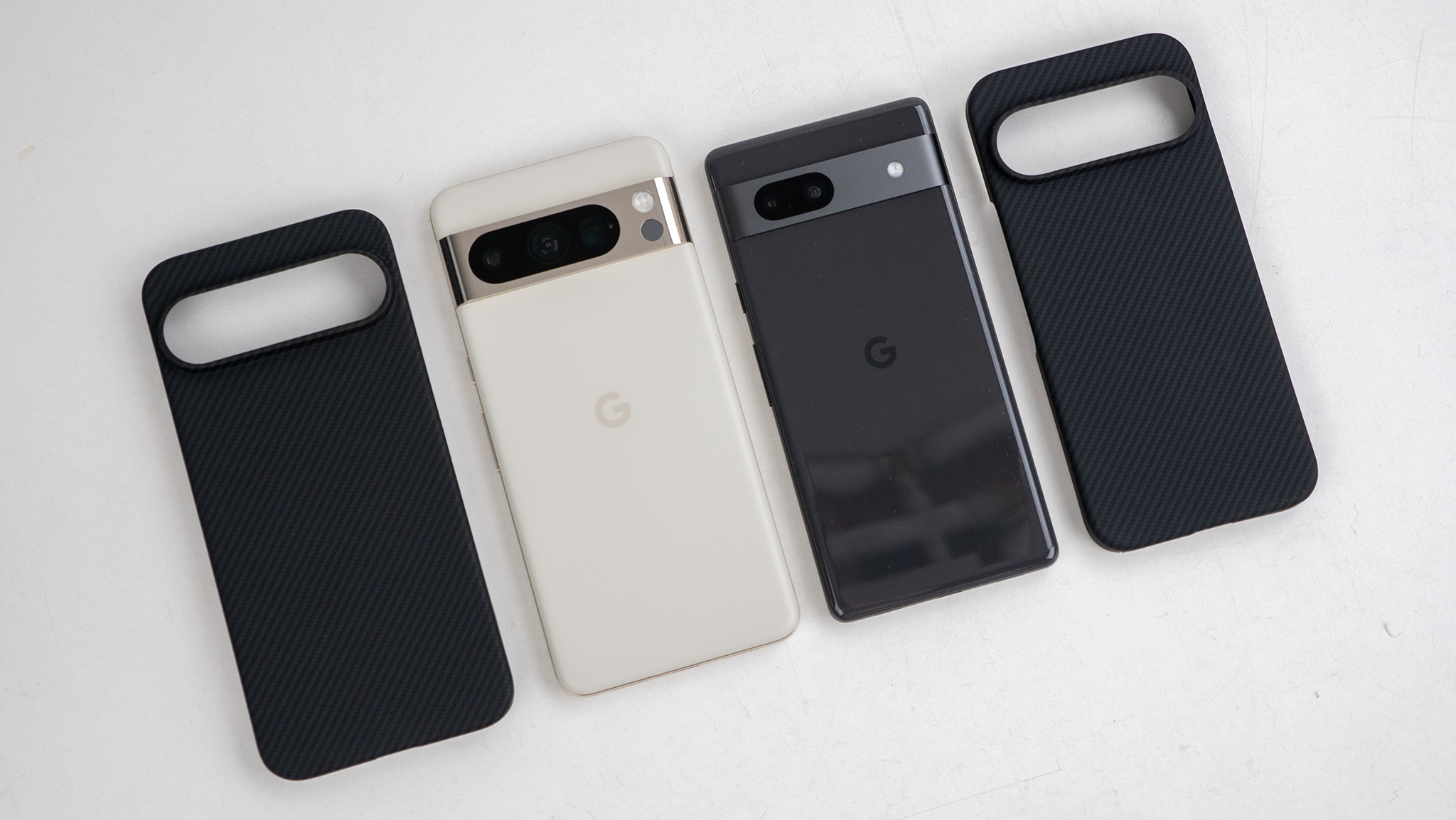 A Thinborne aramid fiber case made for an upcoming Google Pixel 9 phone alongside a Google Pixel 7a and Google Pixel 8 Pro
