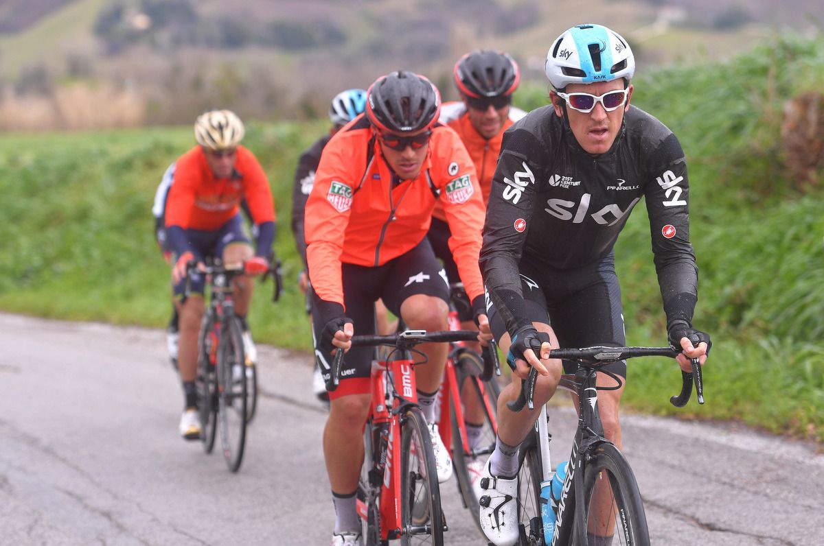 Geraint Thomas (Team Sky) rugged up to avoid the rain