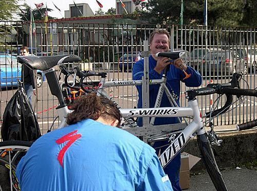 Miles of smiles - Mario Cipollini's faithful mechanic, Roberto "Carube" Lencioni, and his compadre Licio work on Cipo's bikes before Milano-San Remo.