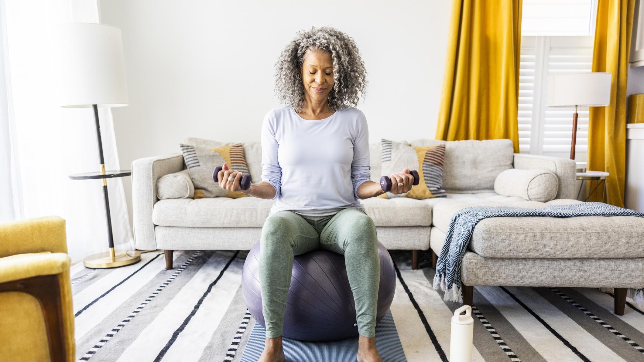 a woman exercising on a yoga ball