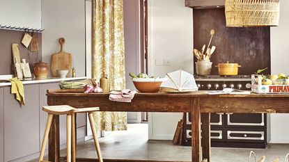 kitchen with wooden table and cutting boards