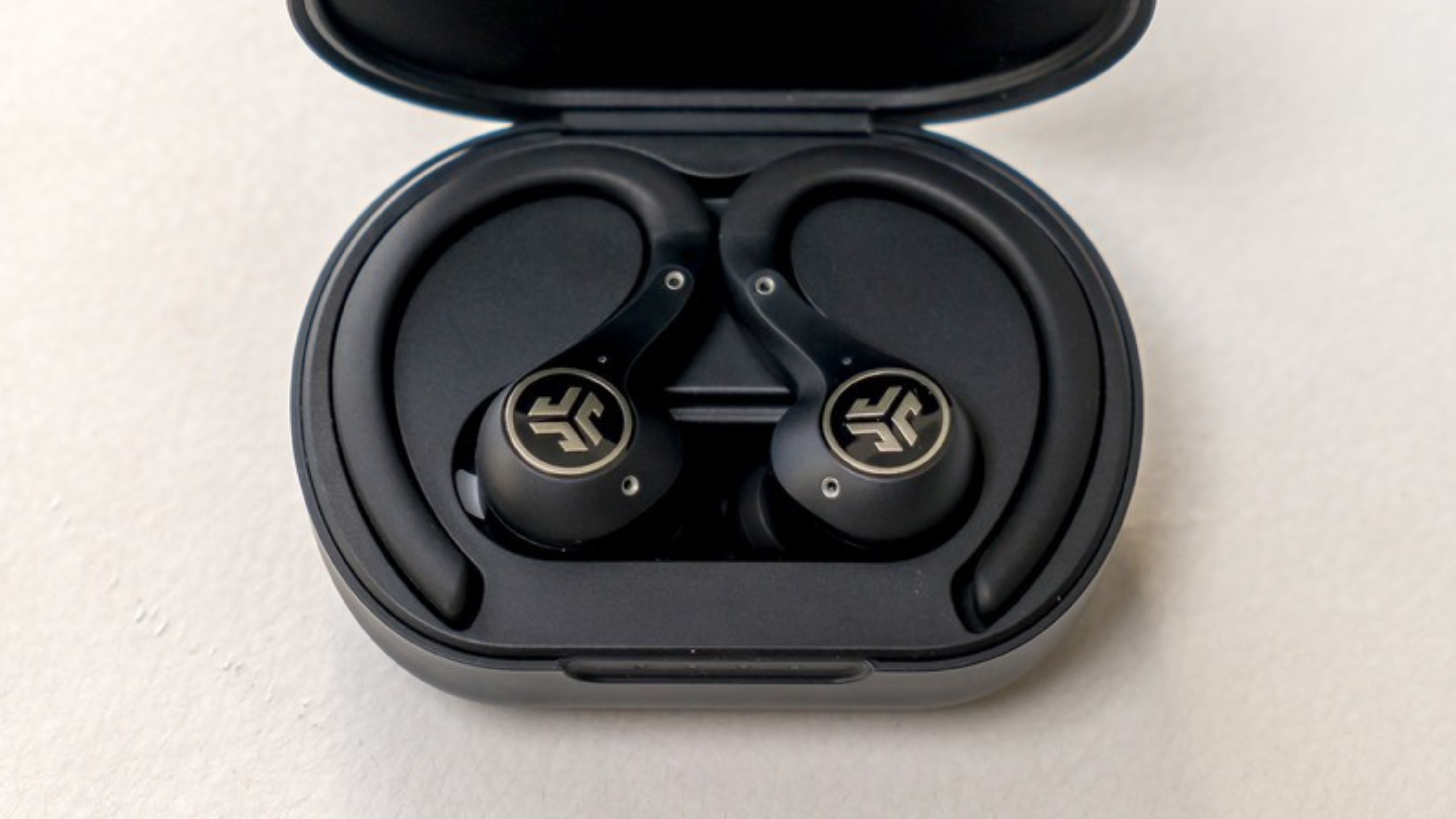 The Jlab Epic Air Sport earbuds in their case.