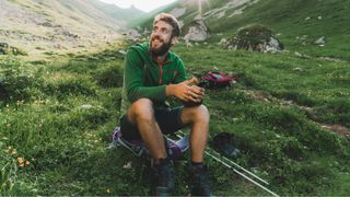 what is a mid layer: hiker taking a breather