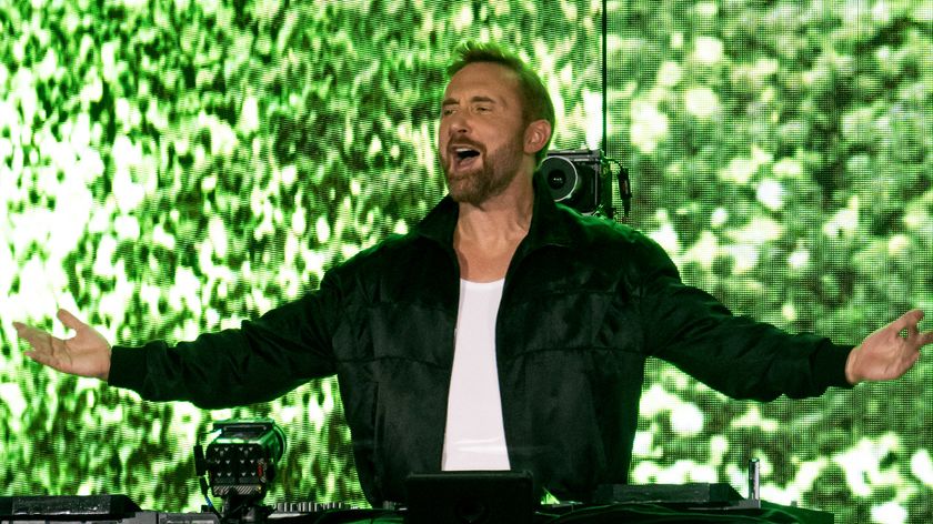 French DJ, composer and producer David Guetta performs on stage during a concert held on the occasion of France&#039;s annual street music festival