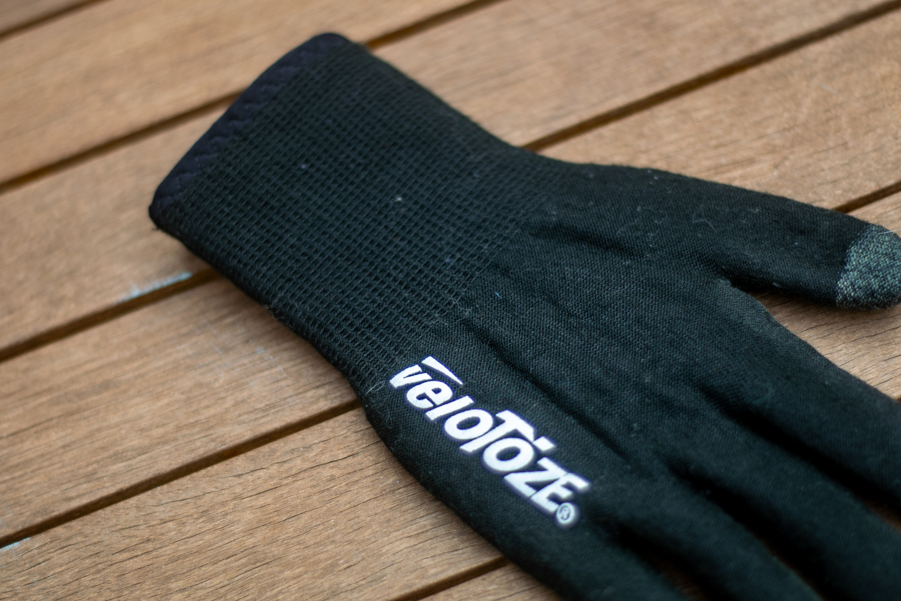 A pair of black VeloToze knitted waterproof gloves
