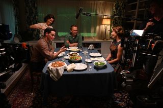 National Geographic's "The Right Stuff" devotes more time to the Mercury astronauts' personal lives, as seen in this behind-the-scenes photo of Colin O'Donoghue (Gordon Cooper, at left), Nora Zehetner (Annie Glenn, at left), Patrick J. Adams (John Glenn) and Eloise Mumford (Trudy Cooper) sharing a meal together.