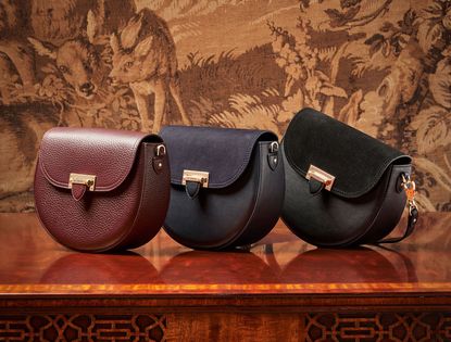 3 bags one in red, one in navy and another in black