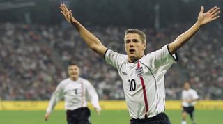 1 Sep 2001: Michael Owen of England celebrates scoring a goal during the FIFA 2002 World Cup Qualifier against Germany played at the Olympic Stadium in Munich, Germany. England won the match 5 - 1. \ Mandatory Credit: Ben Radford /Allsport