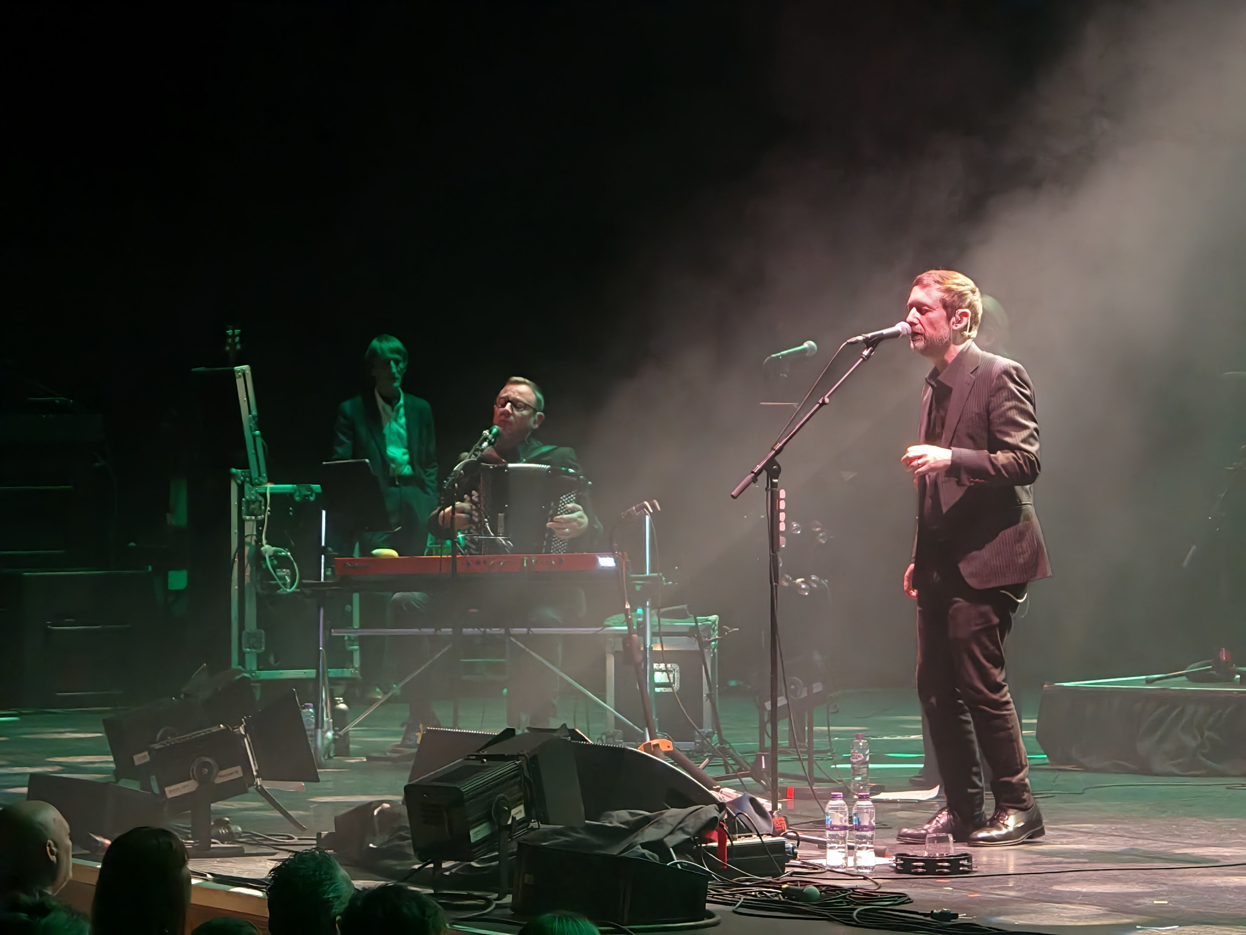 A photo of The Divine Comedy playing live.
