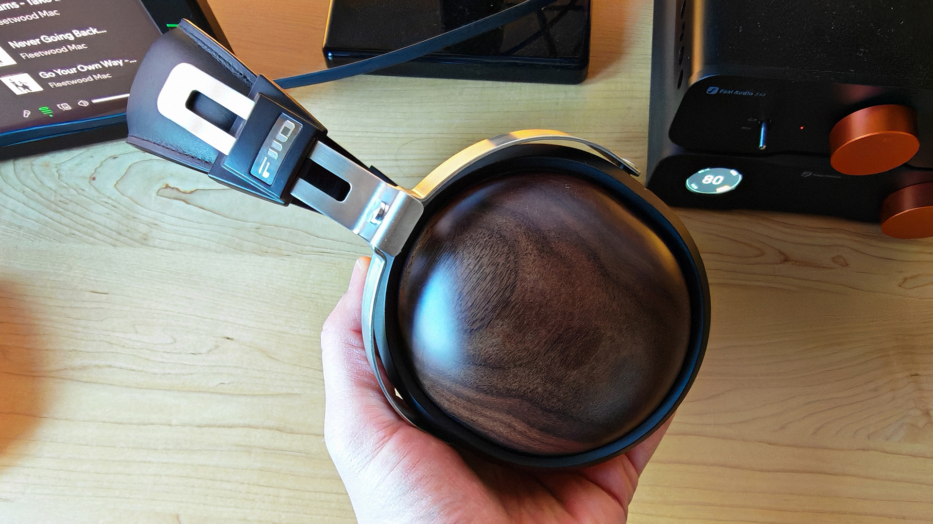 Various photos of the FiiO FT1 headphones, in a home office. 