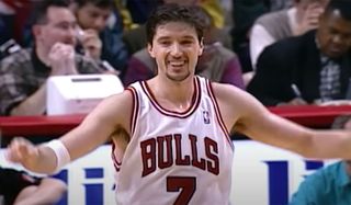 Toni Kukoc celebrating in Bulls jersey.