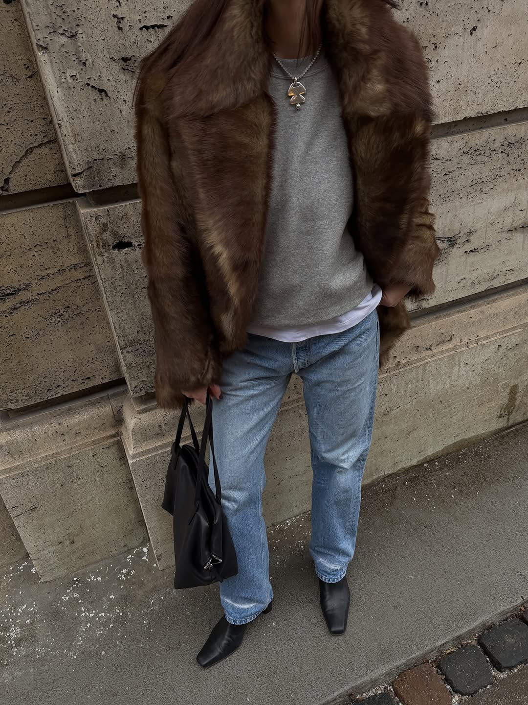 woman wearing brown faux fur coat 2026