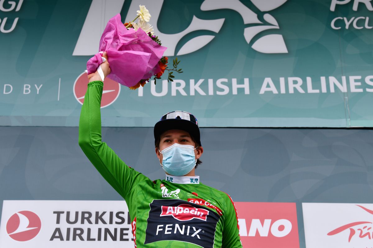 TURGUTREIS TURKEY APRIL 17 Jasper Philipsen of Belgium and Team AlpecinFenix Green Points Jersey celebrates at Podium during the 56th Presidential Cycling Tour Of Turkey 2021 Stage 7 a 180km stage from Marmaris to Turgutreis TUR2021 tourofturkeyTUR on April 17 2021 in Turgutreis Turkey Photo by Stuart FranklinGetty Images