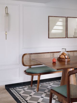 A dining room with a bench