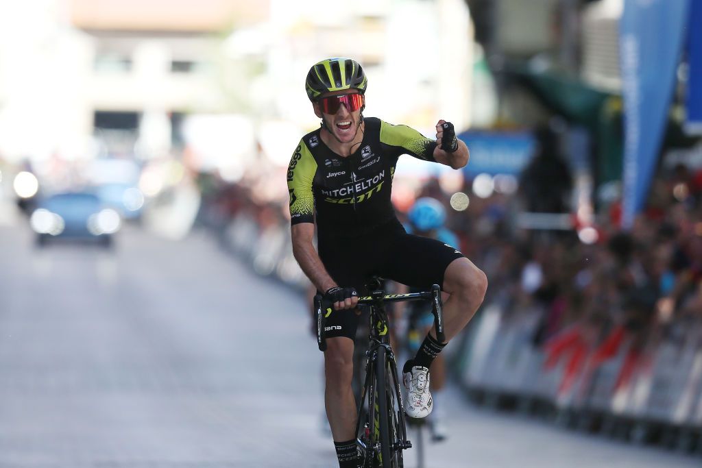 Adam Yates with a fistpump as he crosses the line