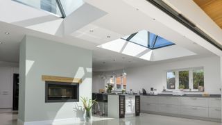 open plan kitchen diner with roof lanterns and bi-fold doors