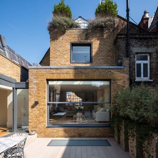 double storey extension with yellow brick and large picture window