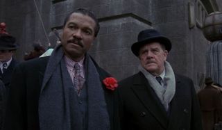 Batman Billy Dee Williams and Pat Hingle stand together on the streets of Gotham