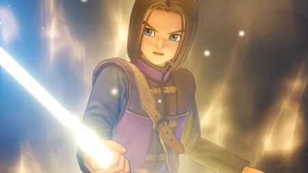 The hero holding a glowing sword during one of the best Dragon Quest games of all time, Dragon Quest 11: Echoes of an Elusive Age
