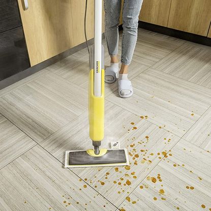 Karcher SC2 Upright Easyfix Steam Cleaner mopping a spill on tiled floor