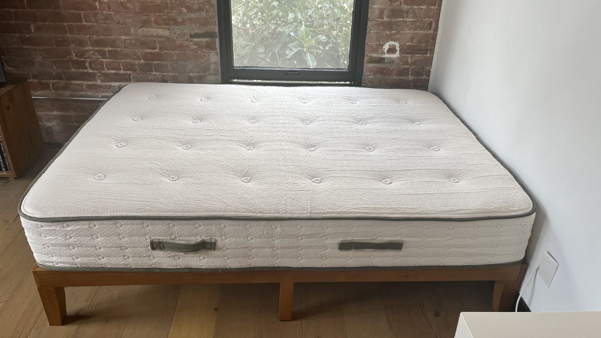 Avocado Green Mattress on wood bed base