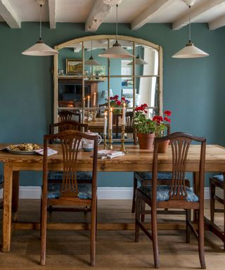 dining room with blue wall and candles on table