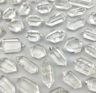 Clear quartz crystals clustered together