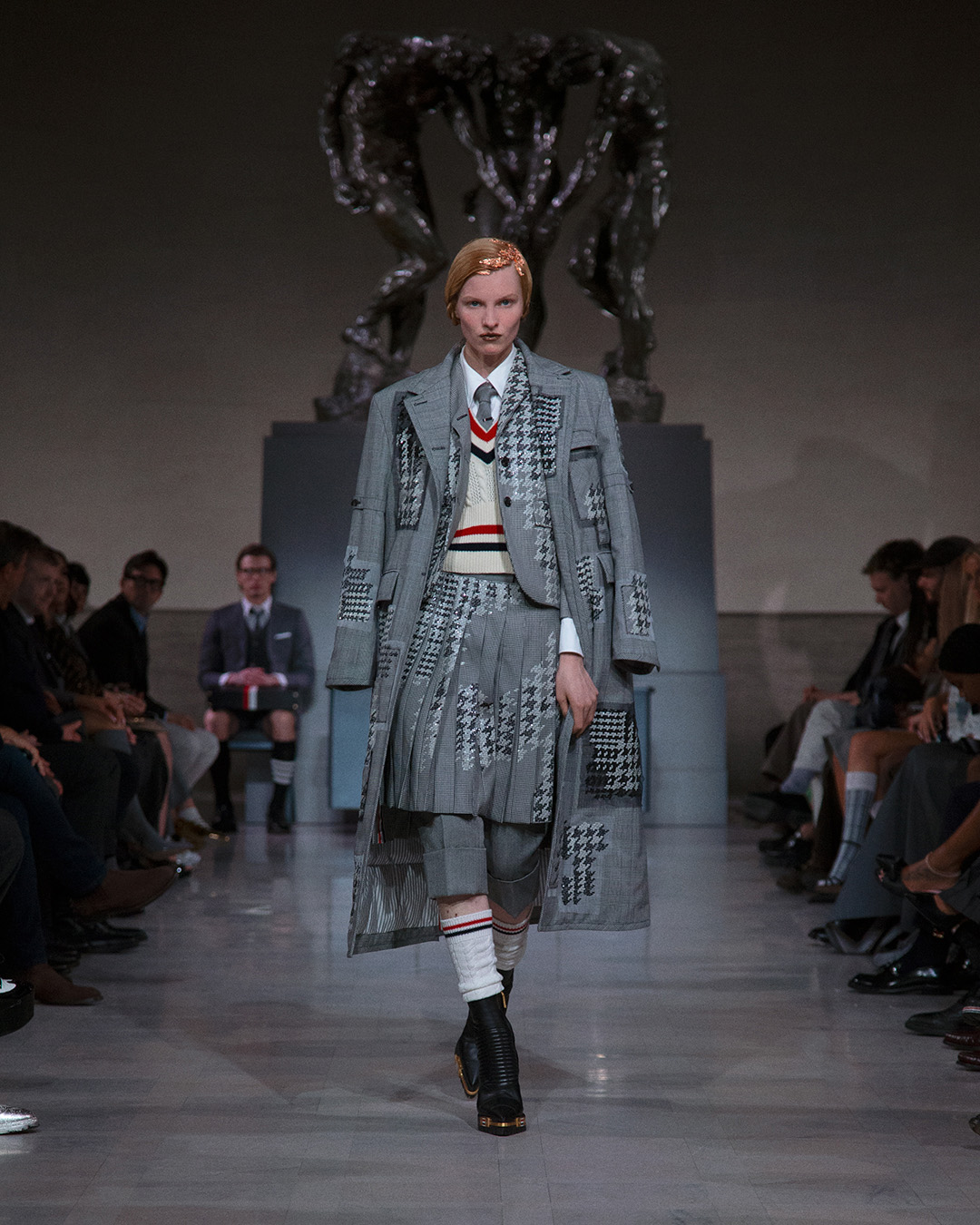 A model walking at the Thom Browne FW26 show at the GQ Bowl ahead of the 2026 Super Bowl.