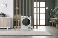 A hotpoint heat pump tumble dryer in a room