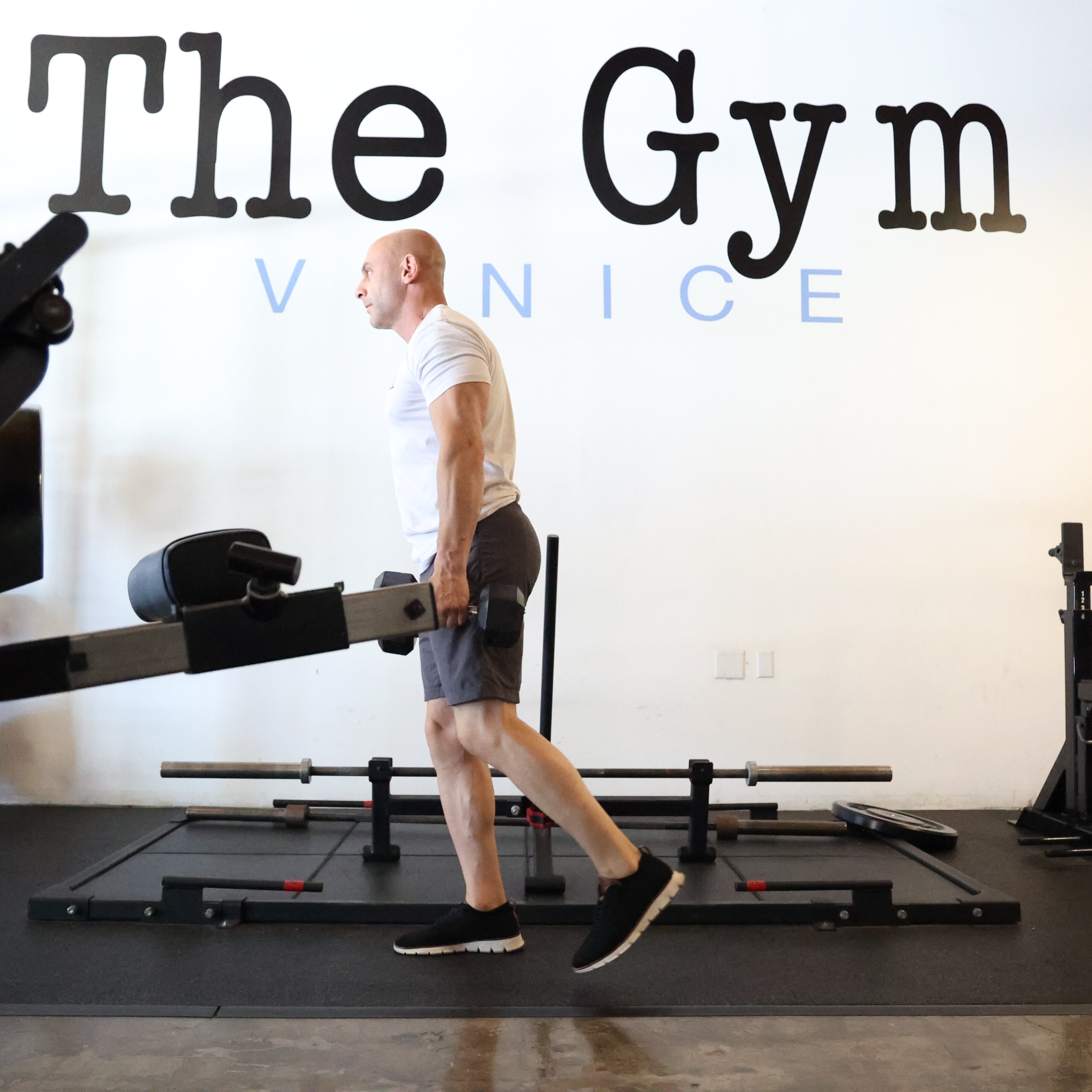 Man exercising in gym with kettlebell