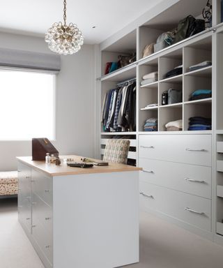 modern walk-in wardrobe with central dressing table