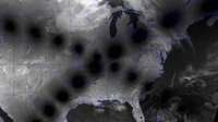A satellite image of the US in black and white with the moon's shadow paths making a cross.