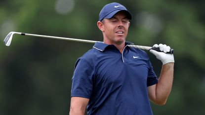 Rory McIlroy looking frustrated after hitting a shot at the 2025 US Open