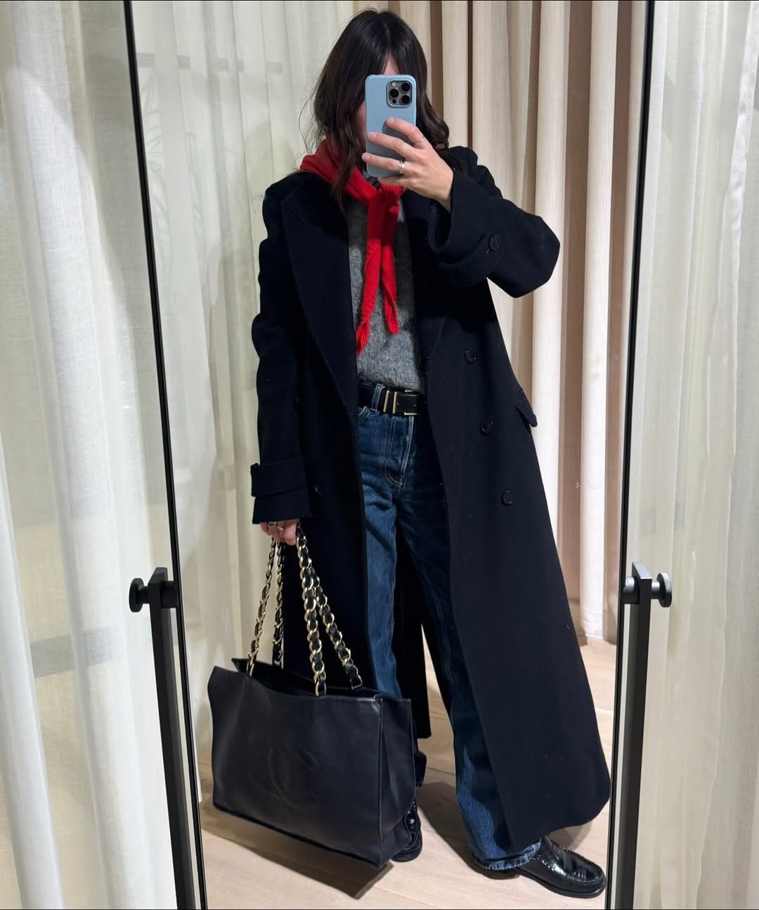 Influencer Claire Wakemen wearing straight-leg jeans and loafers.