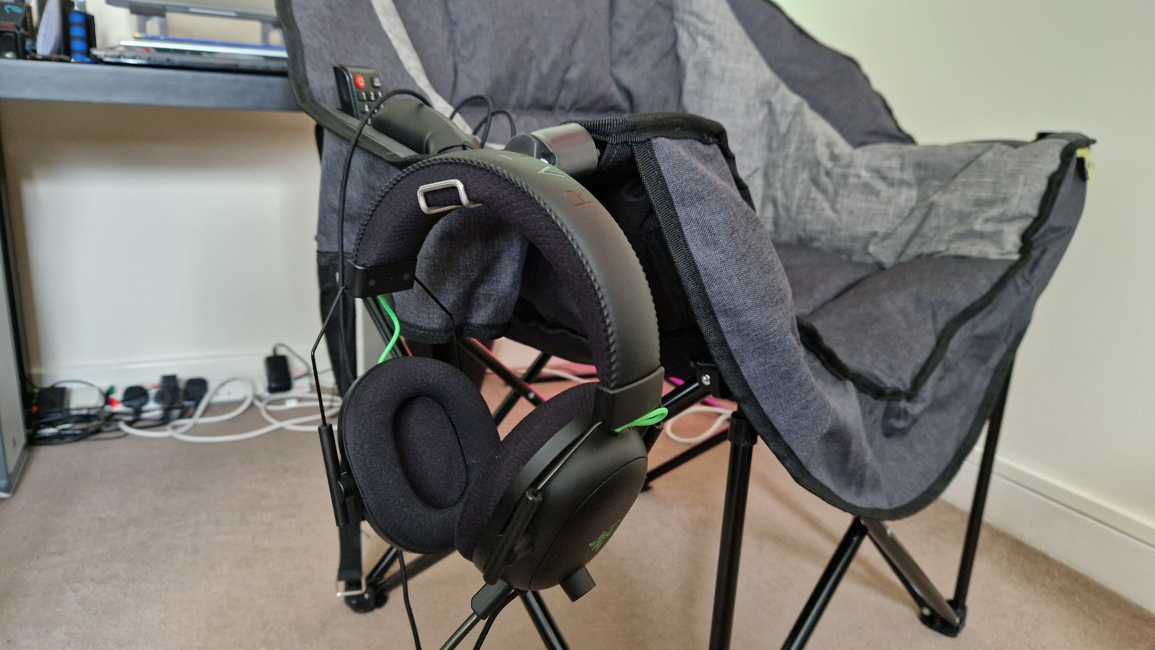 The Foldable Gaming Chair's headset hook, holding a Razer Blackshark V2