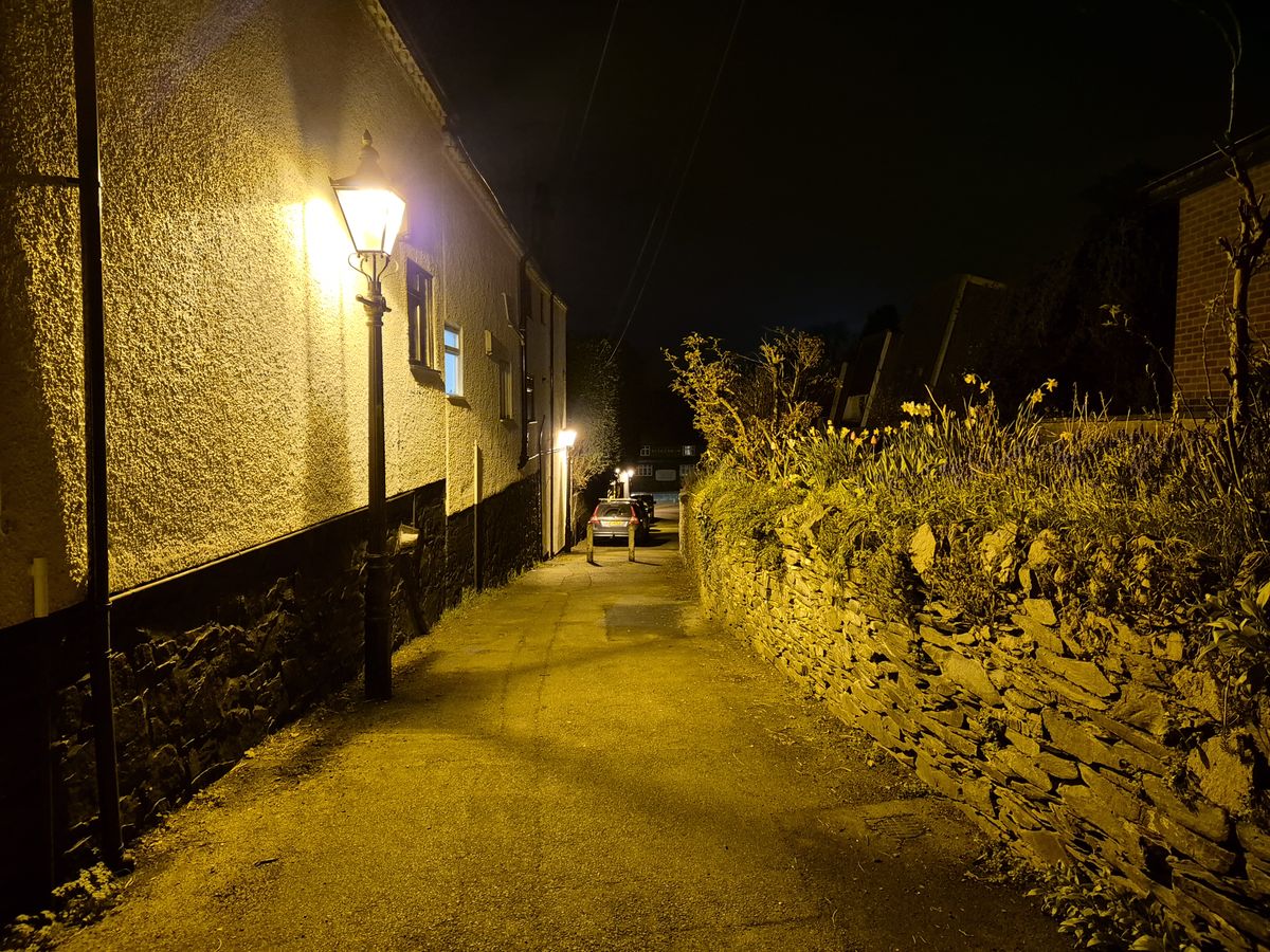 Street at night lit by streetlamps