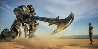 Transformer holding giant sword at human