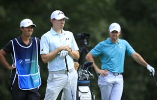 Fitzpatrick and McIlroy wait on the tee