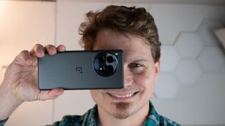 Holding the OnePlus 12R's large camera module up to my face at eye level