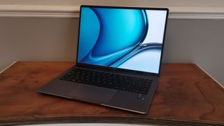 The Huawei MateBook 14s open on a dresser