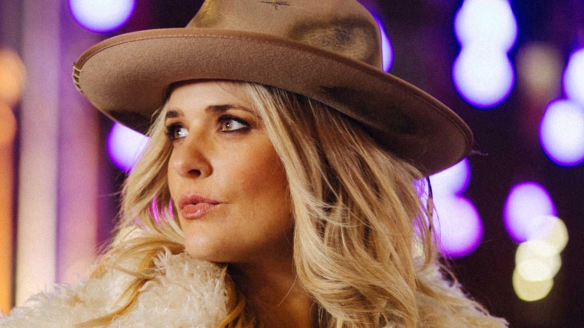 Elles Bailey wearing a cowboy hat headshot