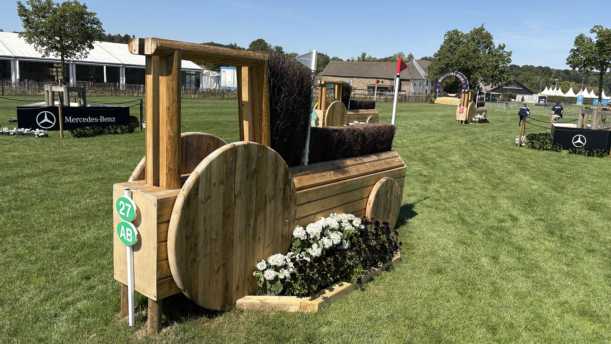 An angled brush fences shaped like a tractor on the eventing World Championships cross-country course
